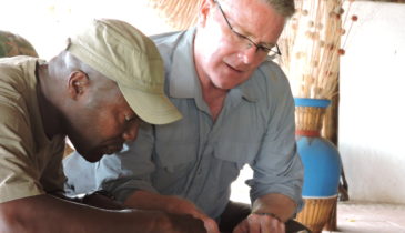 Image of Steve Dunn and another man studying a map