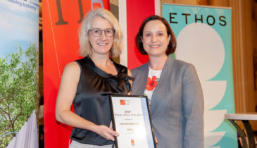 Portrait of two women with one being Lisa Kendal receiving a certificate at the 2019 Women's Breakfast