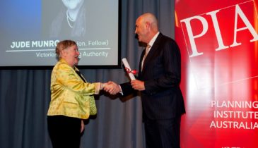 Stuart Moseley presenting Jude Munro with her Planning Institute Australia Fellow recognition