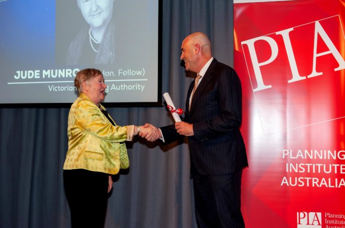 Stuart Moseley presenting Jude Munro with her Planning Institute Australia Fellow recognition
